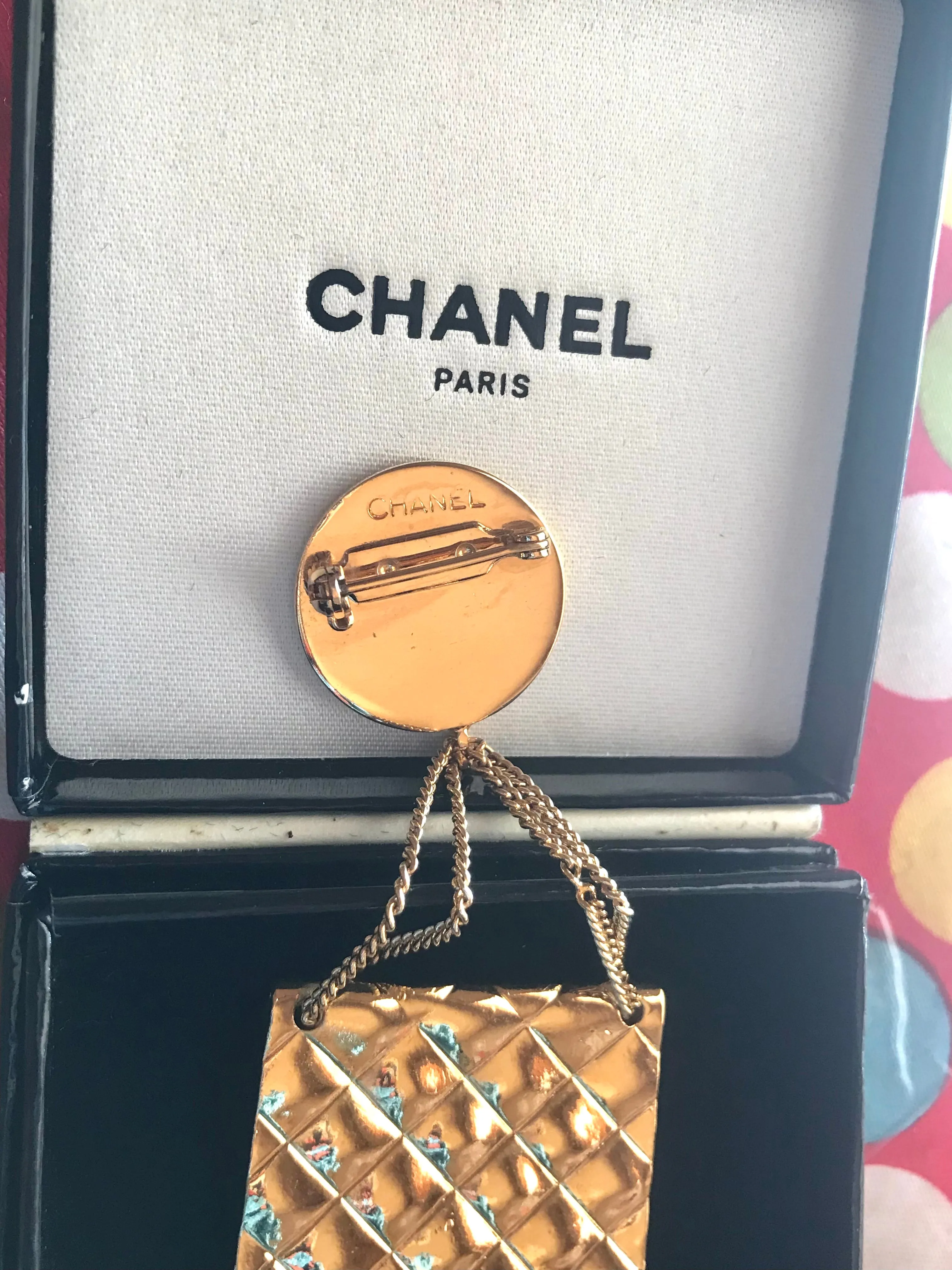 Vintage CHANEL Gold tone brooch with 2.55 classic purse and CC charms. Chic dangling brooch