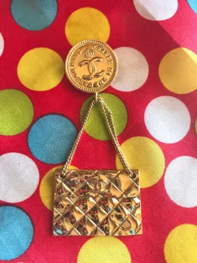 Vintage CHANEL Gold tone brooch with 2.55 classic purse and CC charms. Chic dangling brooch