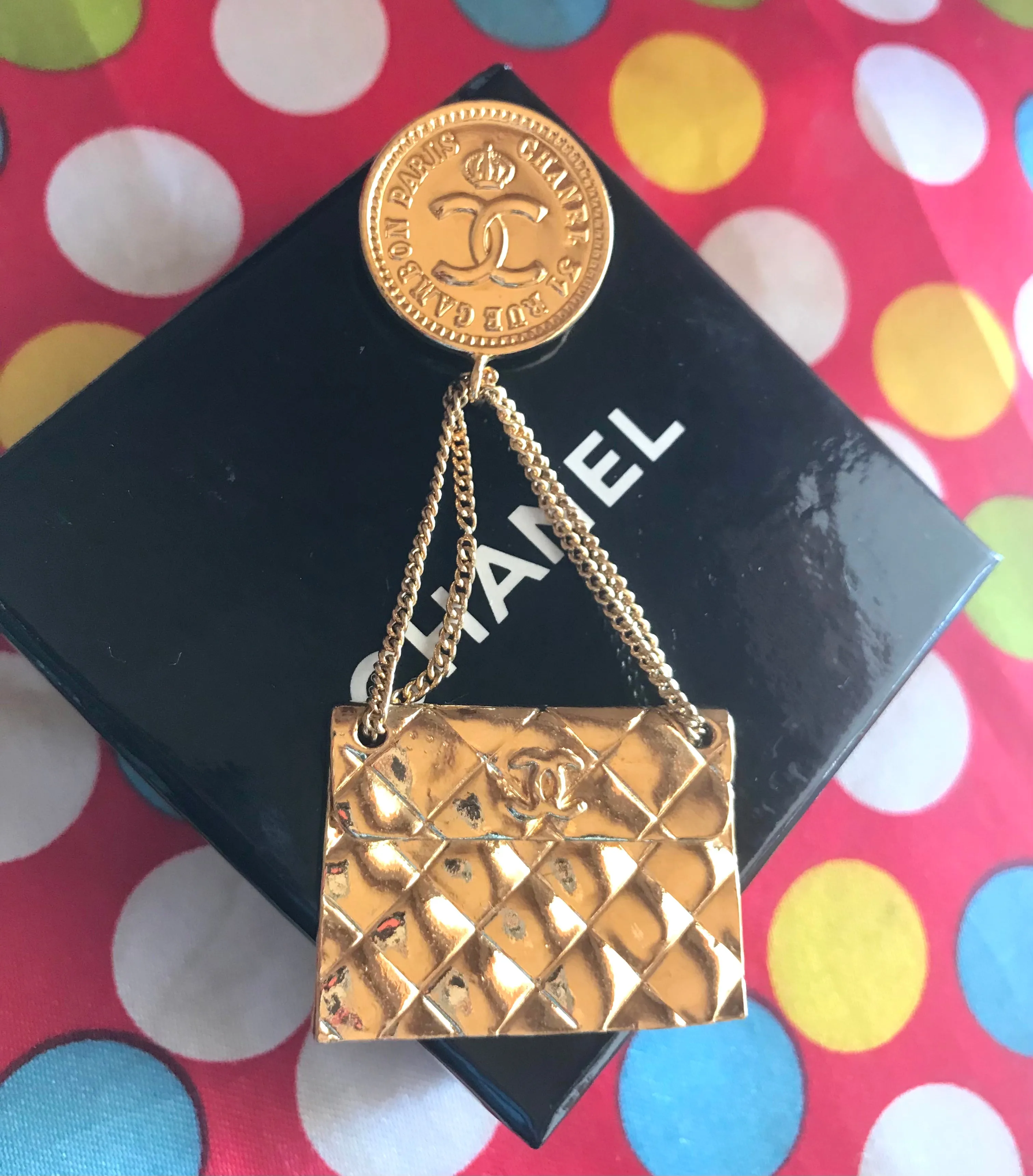 Vintage CHANEL Gold tone brooch with 2.55 classic purse and CC charms. Chic dangling brooch